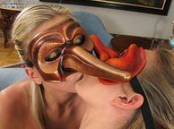 Hot Lesbians Kissing While In Masks - passionate kiss